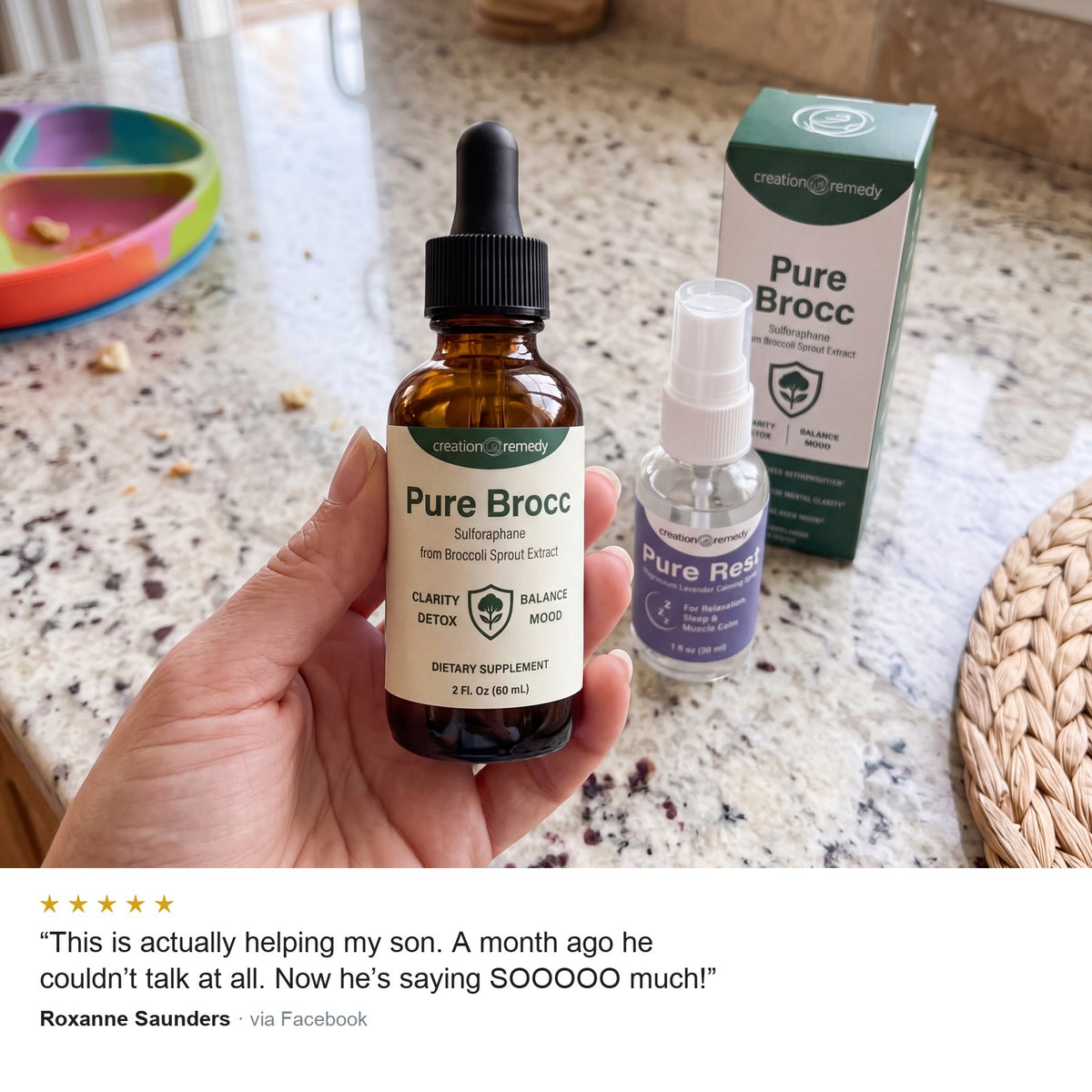 A parent holding Pure Brocc sulforaphane drops in a kitchen with the Pure Rest spray and carton, beside a five star review from Roxanne Saunders